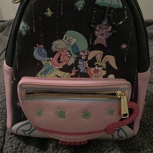 Alive in wonderland Loungefly with minor wear and tear